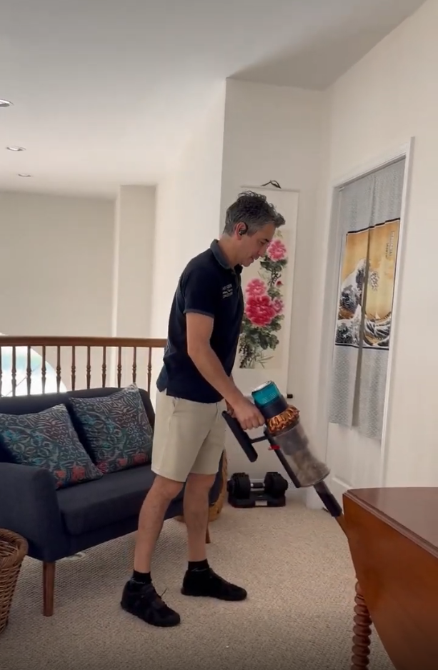 Smart Green team member carefully vacuuming a home